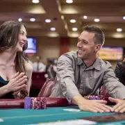 Players smiling and enjoying a live poker game at California Grand Casino